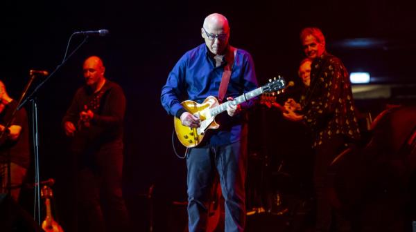 Mark Knopfler perfroming in 2023